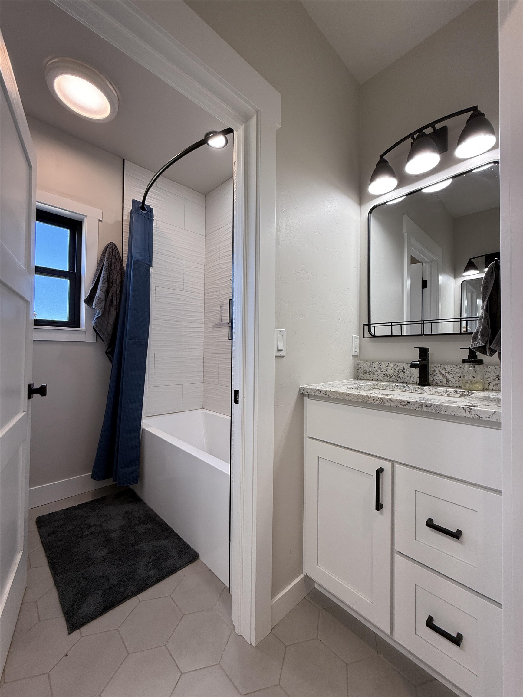 8585 Ellen's Way Austin, CO 81410 - Photo 40 of 42 a bathroom with a sink a vanity and a mirror