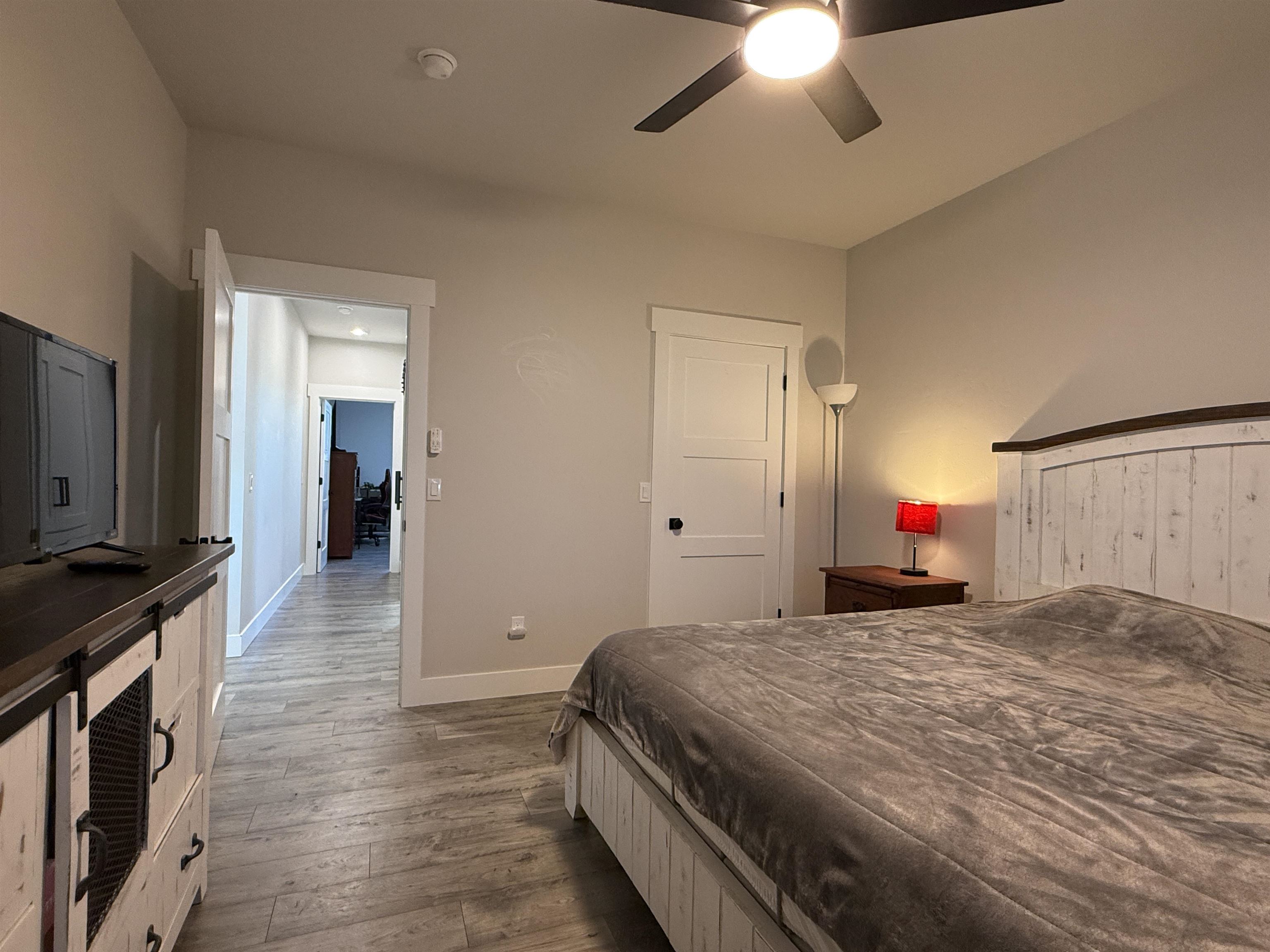 8585 Ellen's Way Austin, CO 81410 - Photo 42 of 42 a bedroom with a bed and a chandelier