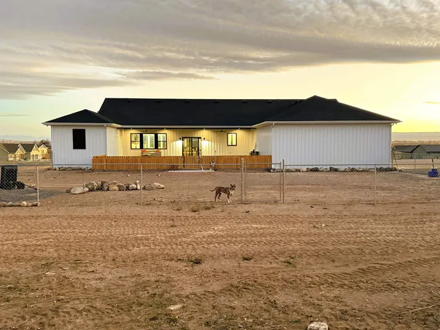 a view of a backyard with plants and a patio