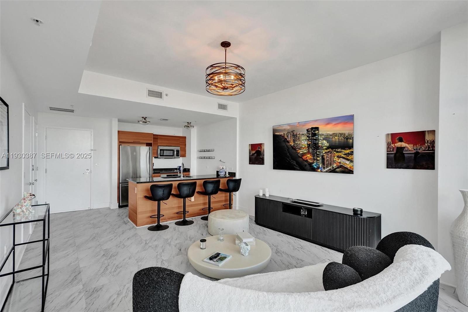 a living room with furniture and a flat screen tv