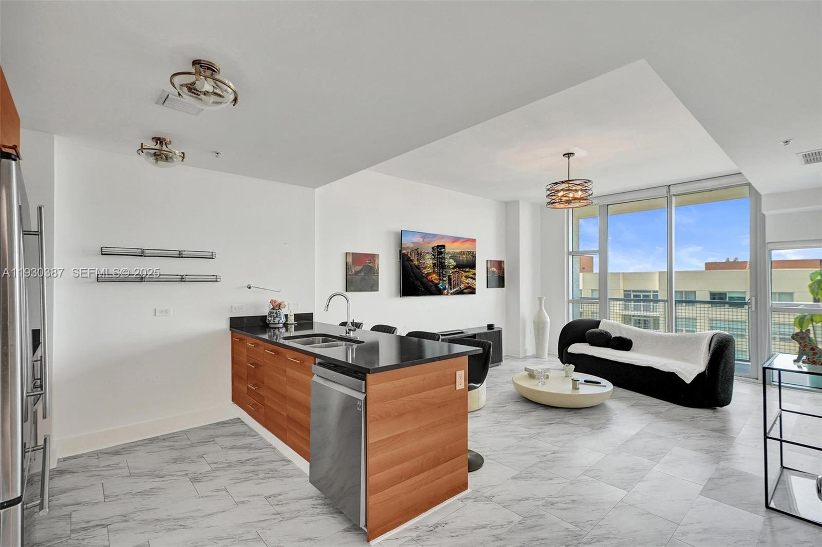 3301 Northeast 1st Avenue, Unit H1105 Miami, FL 33137 - Photo 2 of 34 a living room with furniture and a flat screen tv