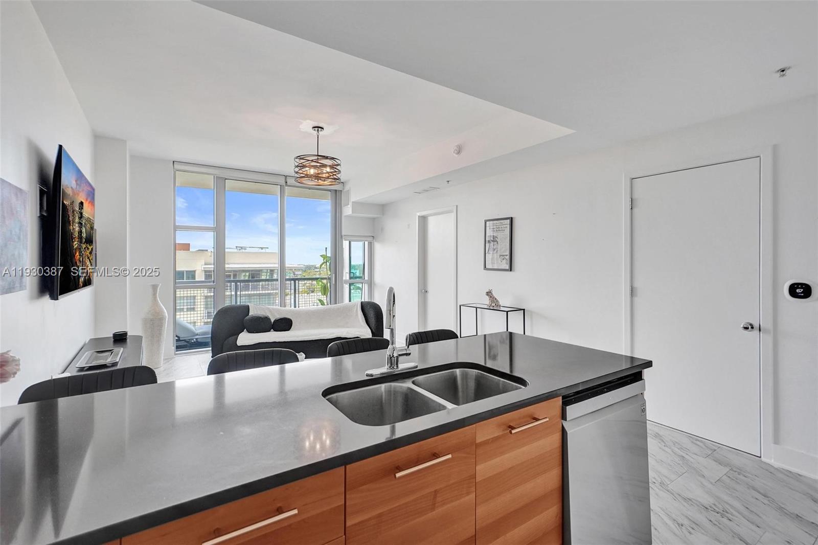 3301 Northeast 1st Avenue, Unit H1105 Miami, FL 33137 - Photo 4 of 34 a kitchen with stainless steel appliances granite countertop a sink a stove and a granite counter top