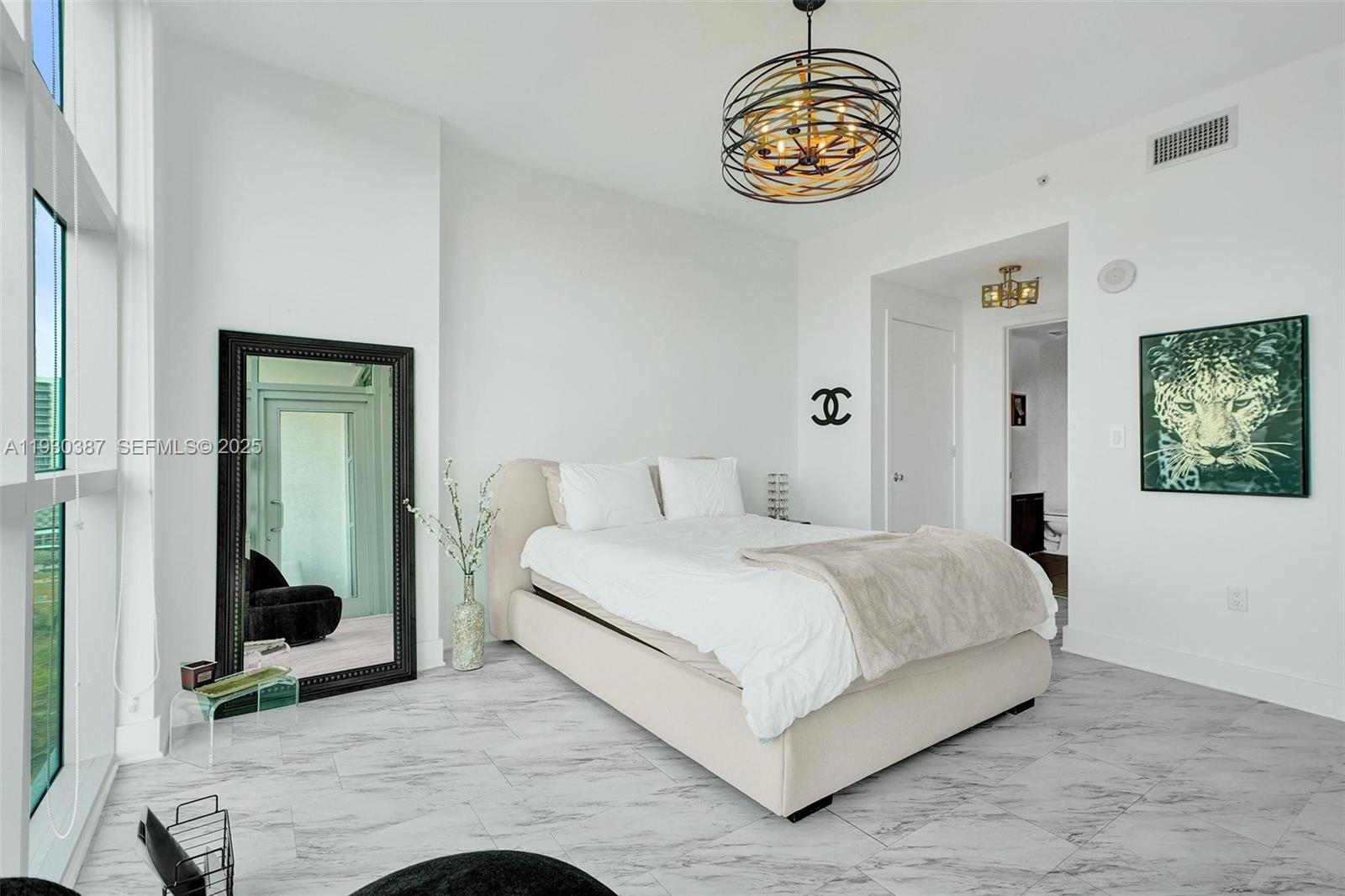 3301 Northeast 1st Avenue, Unit H1105 Miami, FL 33137 - Photo 7 of 34 a bedroom with a bed and a mirror