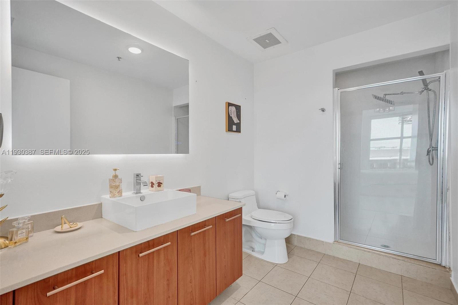 3301 Northeast 1st Avenue, Unit H1105 Miami, FL 33137 - Photo 10 of 34 a bathroom with a sink and a mirror