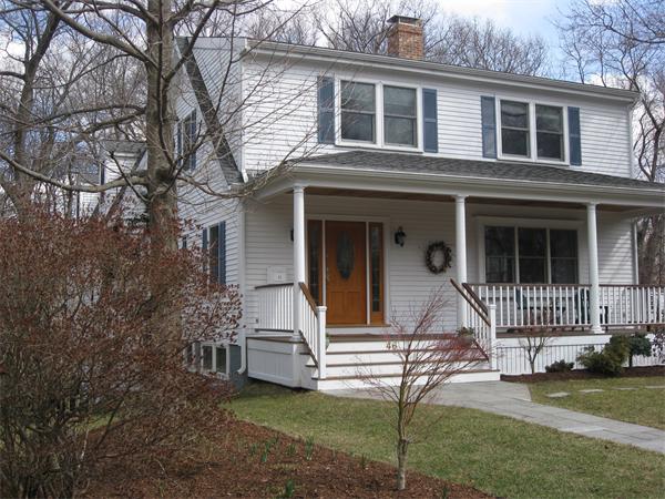 46 Prospect Street Needham, MA 02492 - Photo 1 of 1 a front view of a house with a yard and chairs