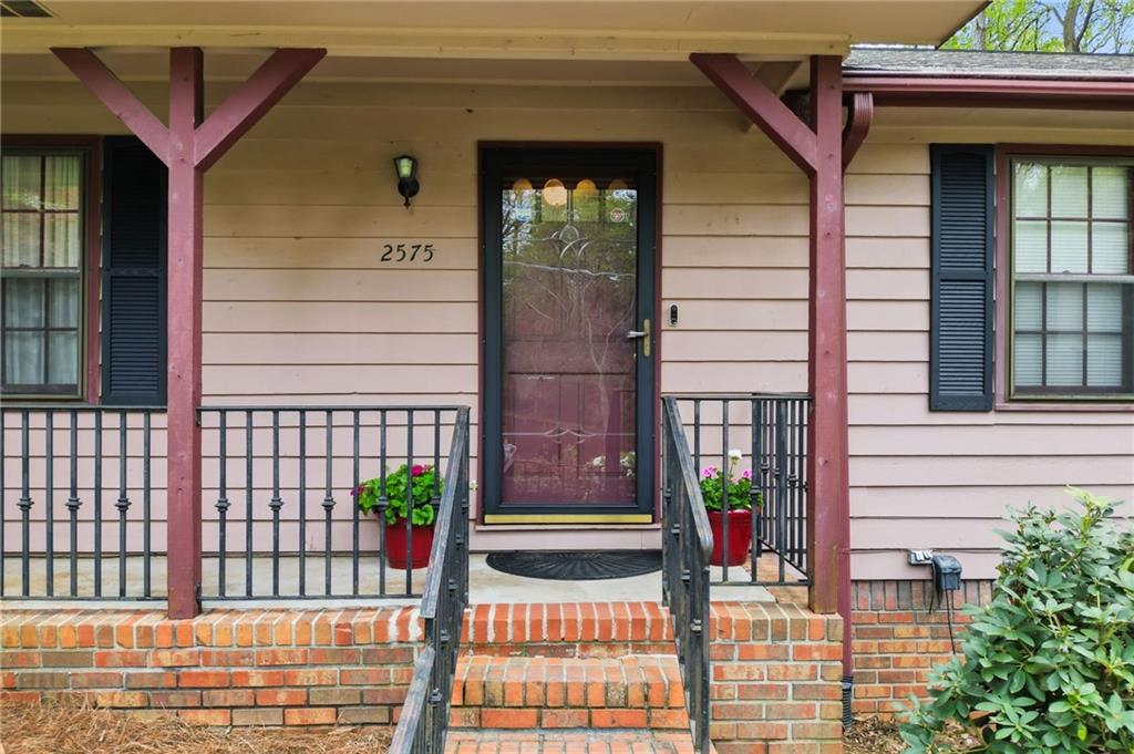 2575 Valleyhill Drive Acworth, GA 30102 - Photo 11 of 48 a view of a brick house with a door