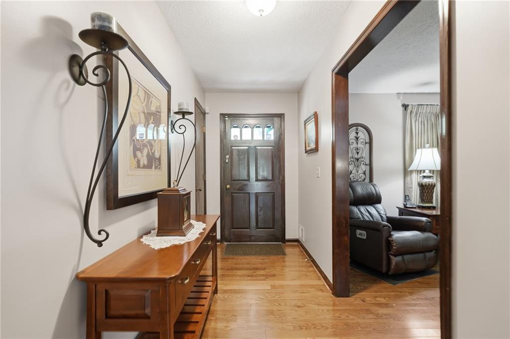 2575 Valleyhill Drive Acworth, GA 30102 - Photo 14 of 48 a living room with furniture a mirror and a fireplace