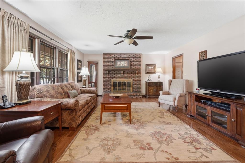 2575 Valleyhill Drive Acworth, GA 30102 - Photo 15 of 48 a living room with furniture and a flat screen tv