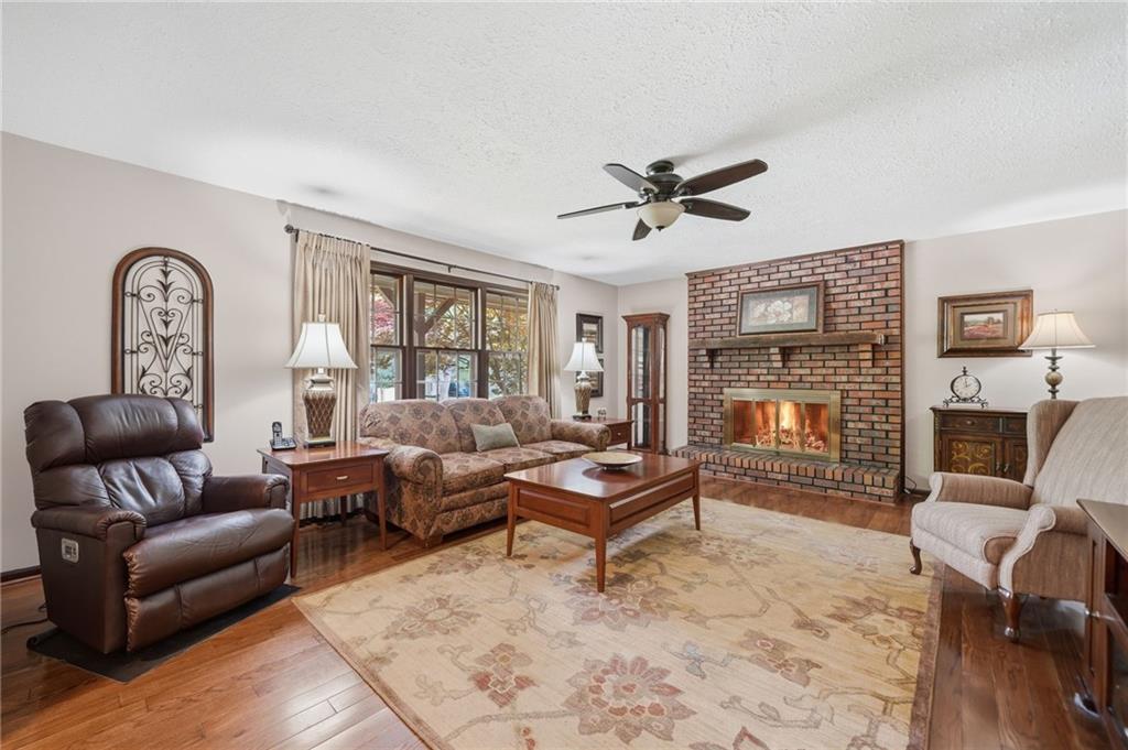 2575 Valleyhill Drive Acworth, GA 30102 - Photo 16 of 48 a living room with furniture fireplace and a window