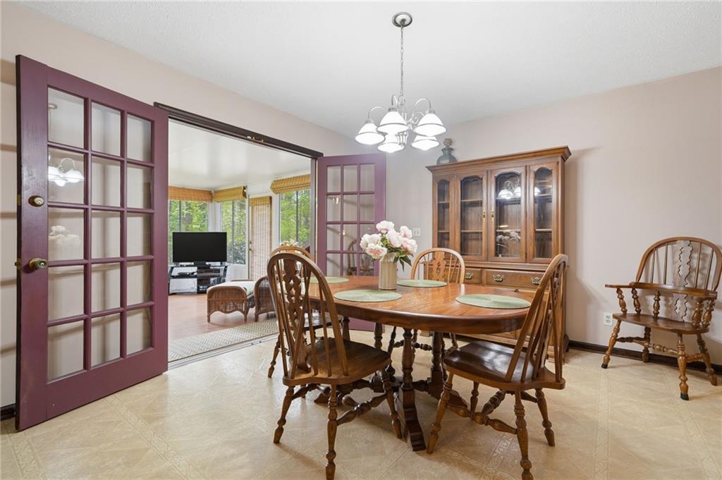 2575 Valleyhill Drive Acworth, GA 30102 - Photo 21 of 48 a view of a dining room with furniture window and wooden floor