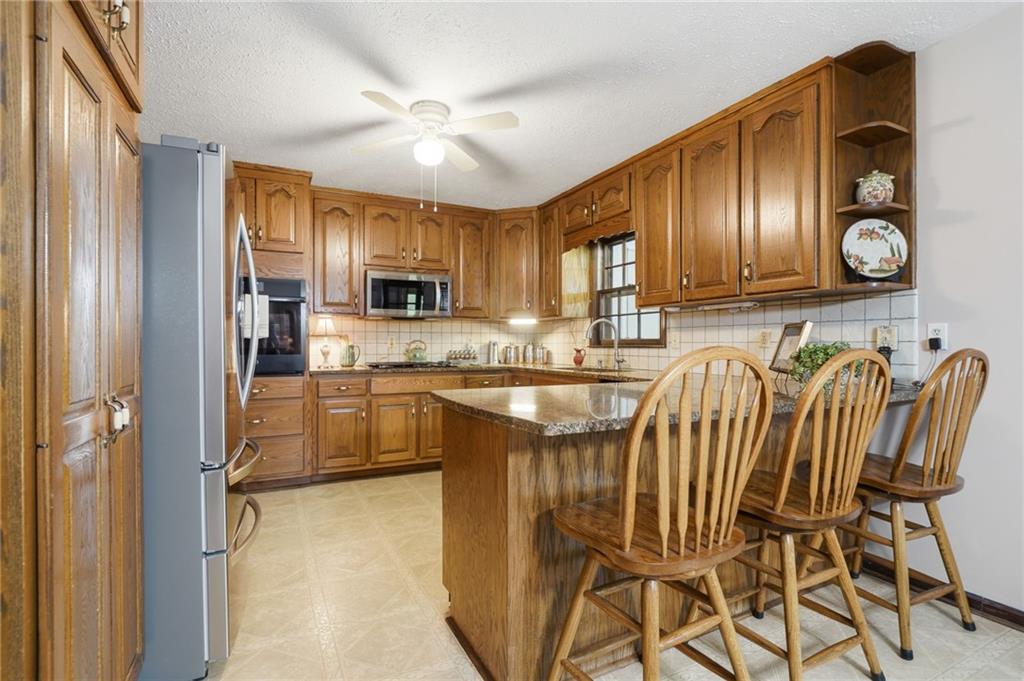 2575 Valleyhill Drive Acworth, GA 30102 - Photo 22 of 48 a kitchen with a refrigerator and a sink