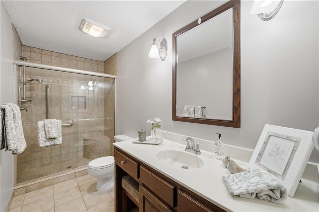 2575 Valleyhill Drive Acworth, GA 30102 - Photo 31 of 48 a bathroom with a double vanity sink mirror and shower