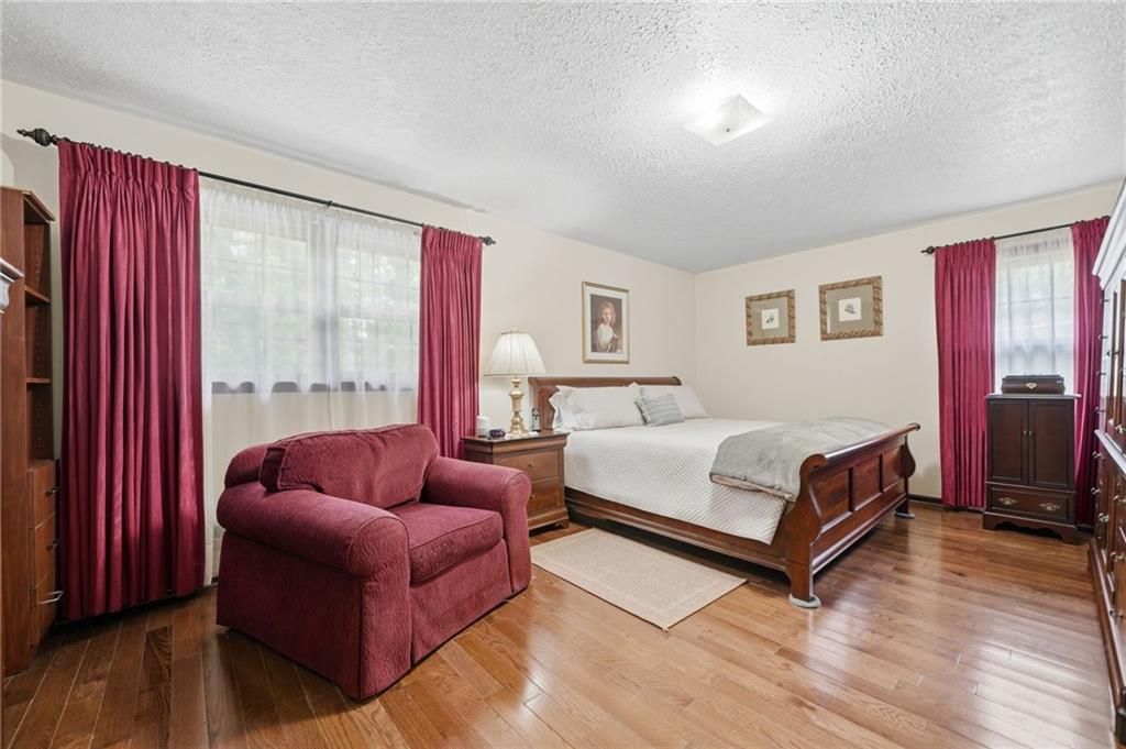 2575 Valleyhill Drive Acworth, GA 30102 - Photo 32 of 48 a bedroom with a bed and a couch