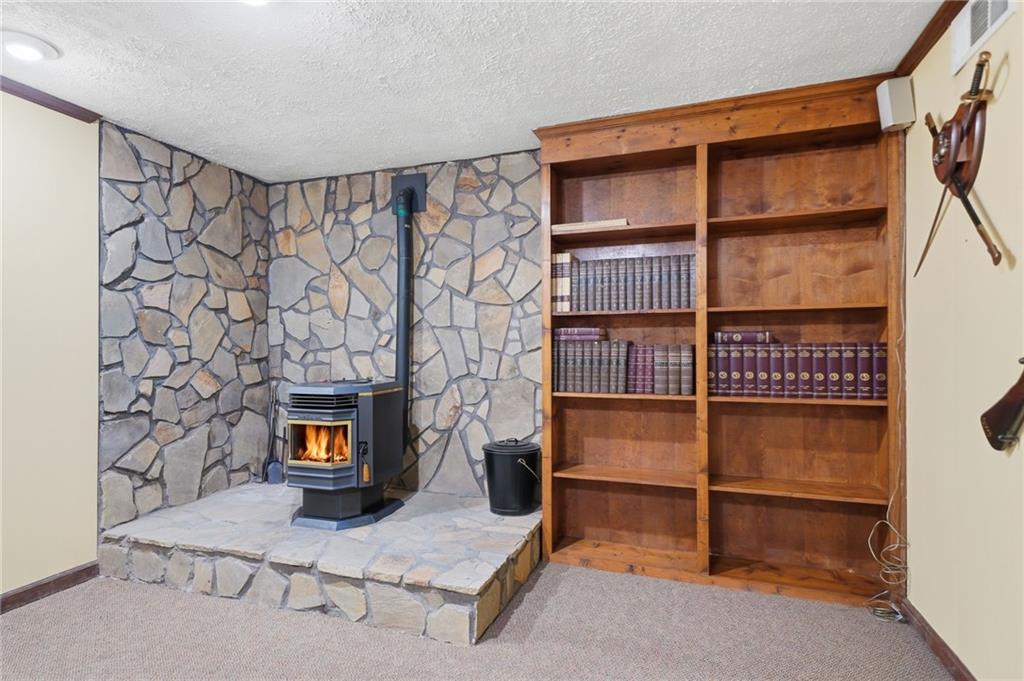 2575 Valleyhill Drive Acworth, GA 30102 - Photo 40 of 48 a living room with a wooden floor and a fireplace