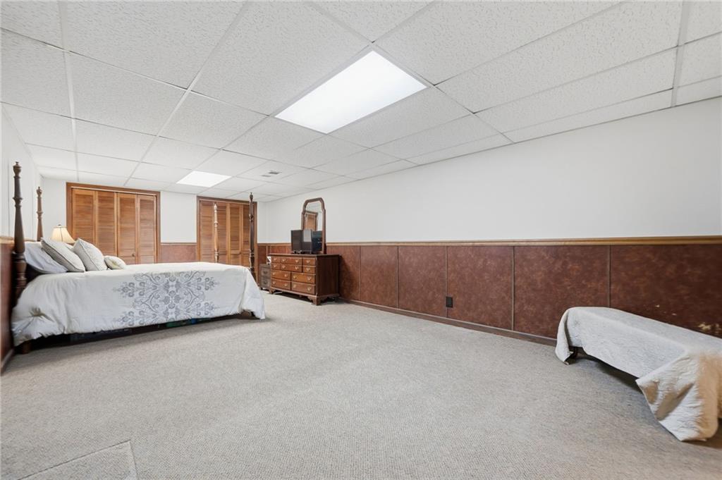 2575 Valleyhill Drive Acworth, GA 30102 - Photo 42 of 48 a bedroom with a bed and couch
