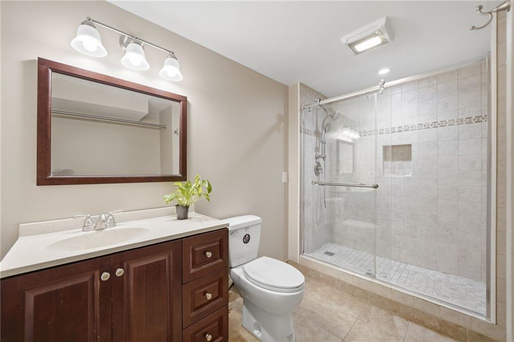 2575 Valleyhill Drive Acworth, GA 30102 - Photo 45 of 48 a bathroom with a sink vanity mirror and toilet