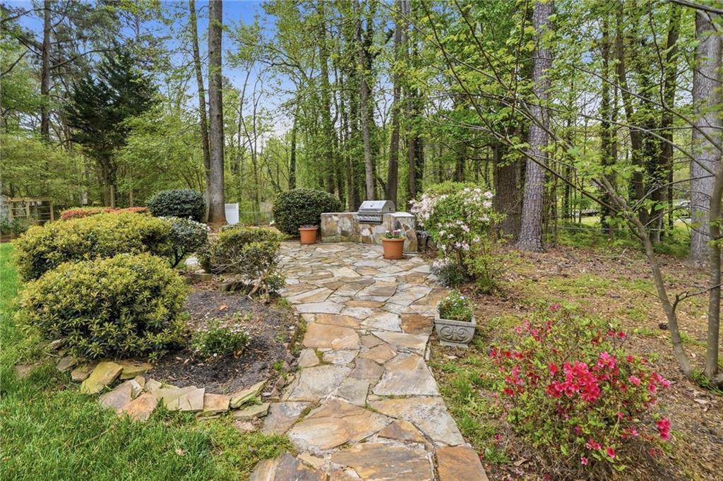 2575 Valleyhill Drive Acworth, GA 30102 - Photo 5 of 48 a view of a chair and tables in the backyard of the house