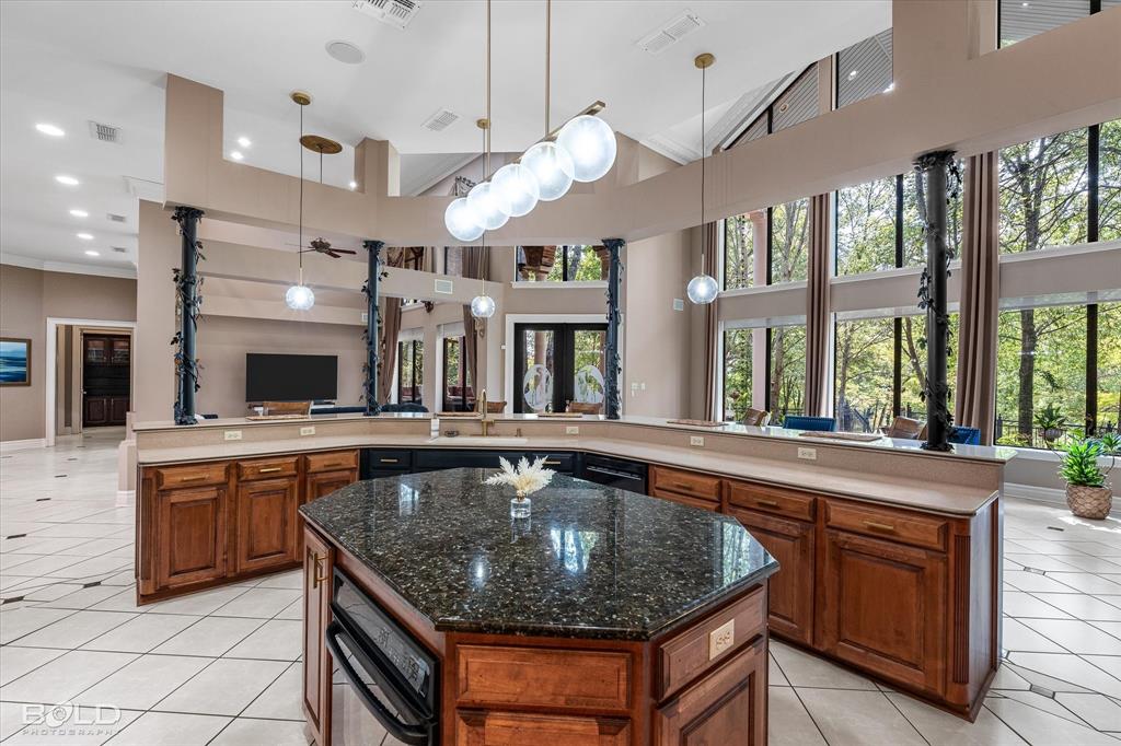 36 Golf Club Drive Haughton, LA 71037 - Photo 40 of 40 a kitchen with stainless steel appliances granite countertop a stove and a sink