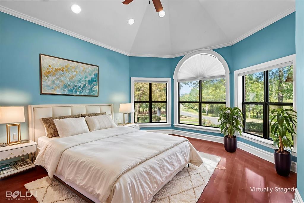 36 Golf Club Drive Haughton, LA 71037 - Photo 22 of 40 a spacious bedroom with a large bed and a large window