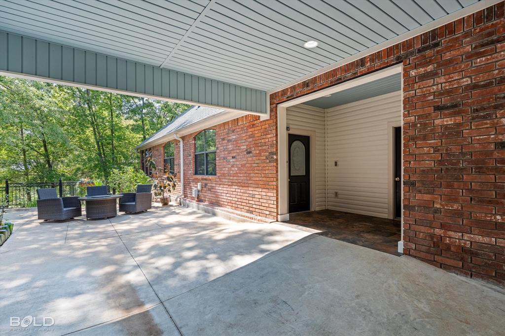 36 Golf Club Drive Haughton, LA 71037 - Photo 33 of 40 a view of a house with backyard and porch