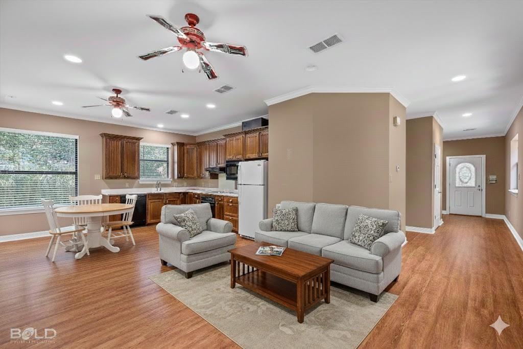36 Golf Club Drive Haughton, LA 71037 - Photo 34 of 40 a living room with furniture or wooden floor and a large window