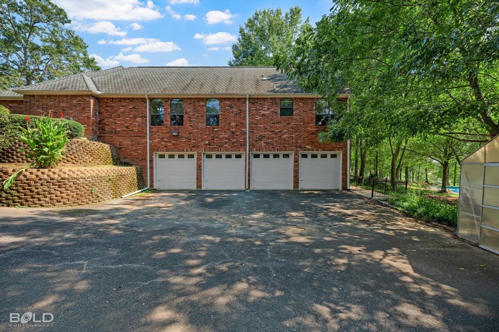 36 Golf Club Drive Haughton, LA 71037 - Photo 39 of 40 a view of a house with a yard