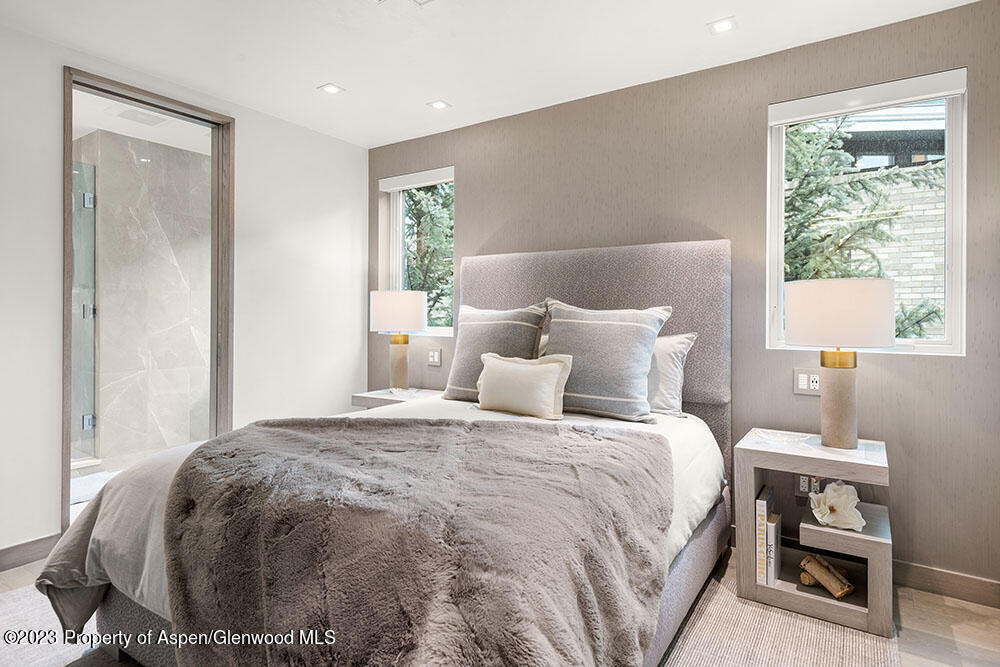 802 East Cooper Avenue, Unit 3 Aspen, CO 81611 - Photo 18 of 28 a bedroom with a bed and a window