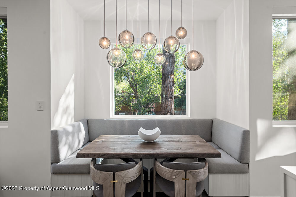 802 East Cooper Avenue, Unit 3 Aspen, CO 81611 - Photo 4 of 28 a view of a dining room that has a table and a chair