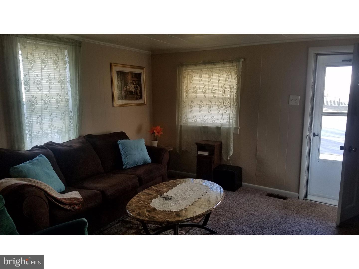 419 Blue Bell Road Williamstown, NJ 08094 - Photo 8 of 18 a living room with furniture and a window