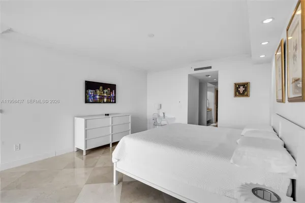 a bedroom with a bed and a table