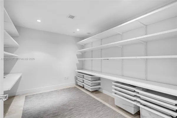 a view of an empty walk in closet