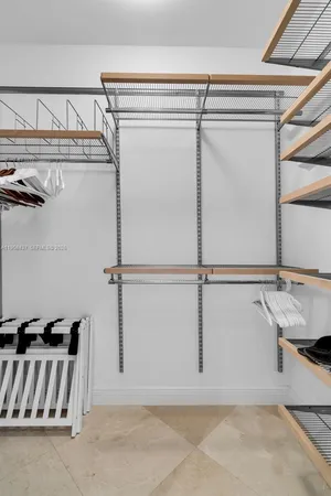 a view of a room with rack and a rug