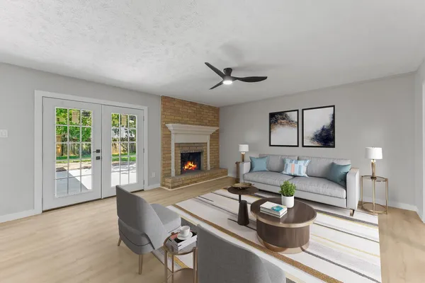 a living room with furniture and a fireplace