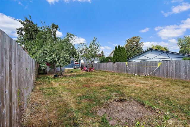 a backyard of a house with lots of green space