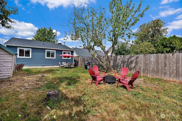 a backyard of a house with seating space