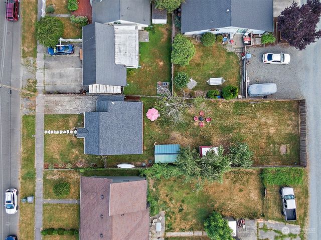 an aerial view of multiple houses with outdoor space