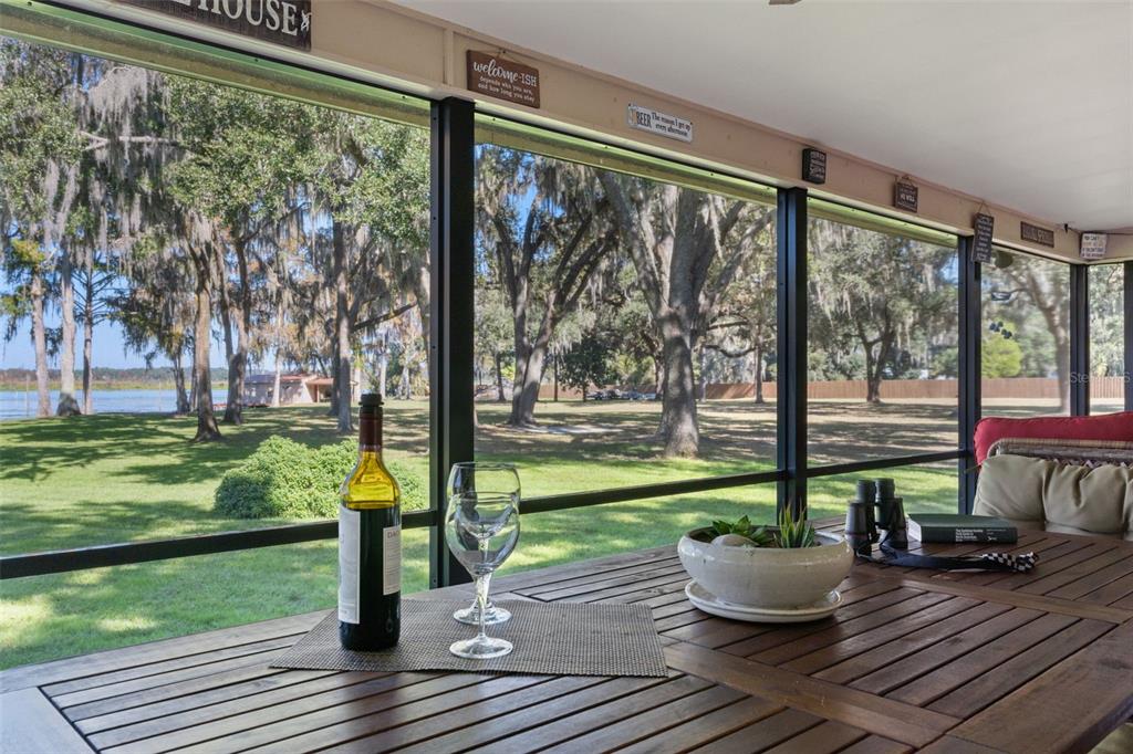 6185 West Riverbend Road Dunnellon, FL 34433 - Photo 11 of 49 a view of a house with backyard and sitting area