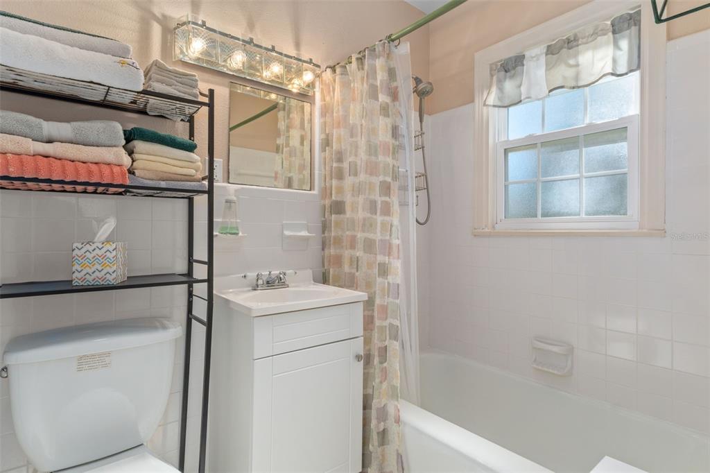 6185 West Riverbend Road Dunnellon, FL 34433 - Photo 25 of 49 a bathroom with a sink a toilet and shower