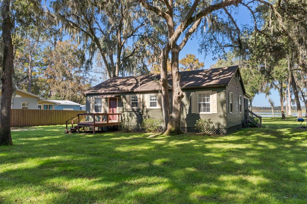 6185 West Riverbend Road Dunnellon, FL 34433 - Photo 26 of 49 a view of a house with a yard