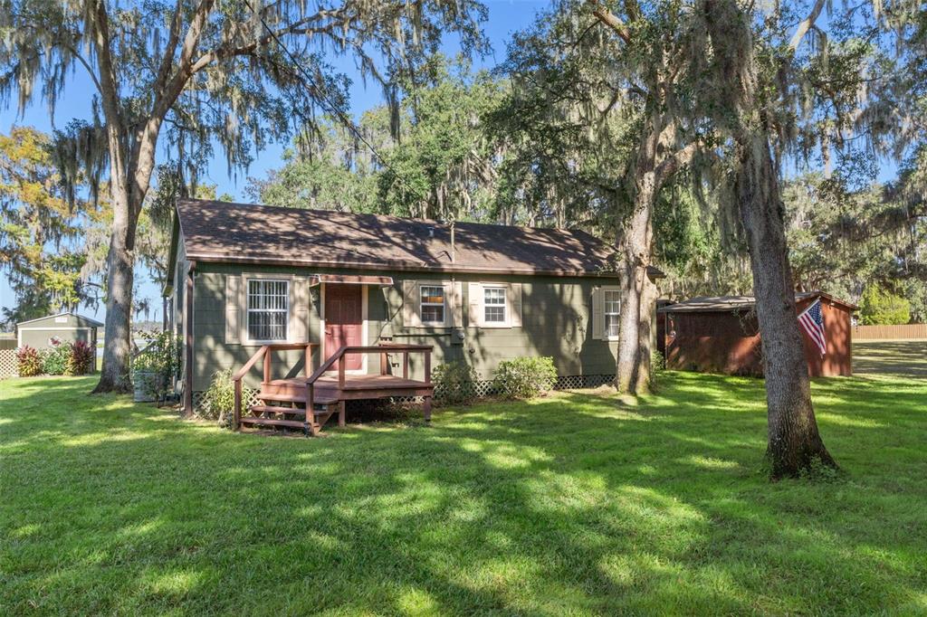 6185 West Riverbend Road Dunnellon, FL 34433 - Photo 7 of 49 a front view of a house with garden