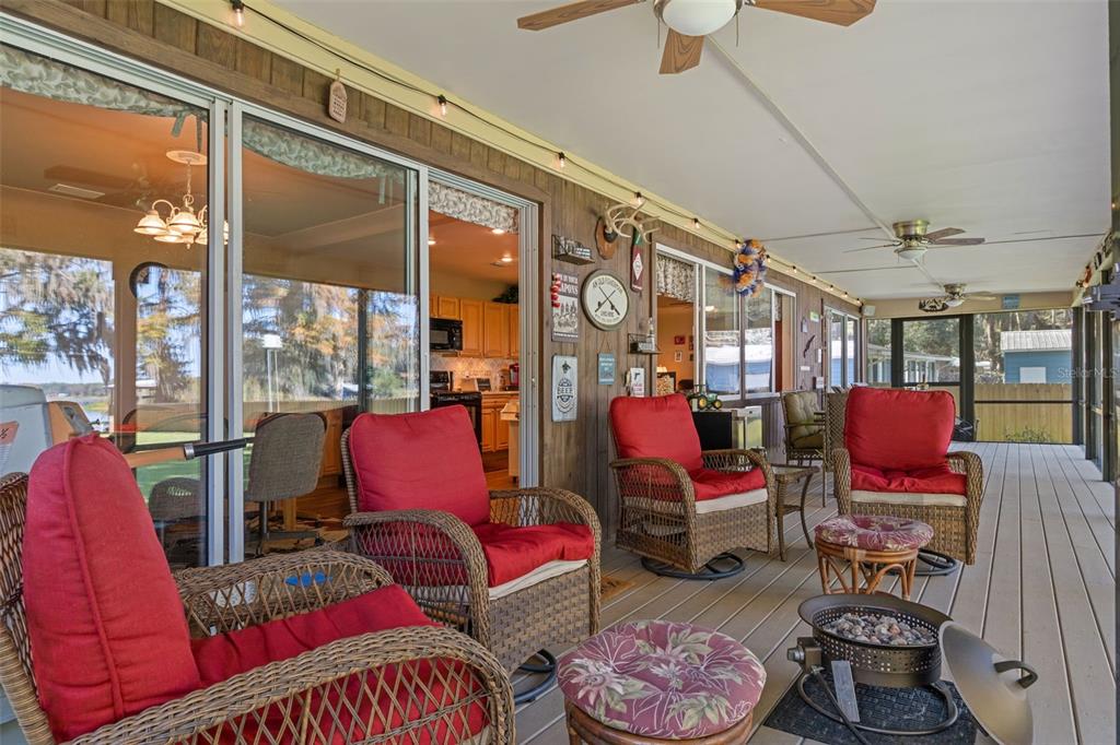 6185 West Riverbend Road Dunnellon, FL 34433 - Photo 9 of 49 a living room with furniture a rug and a window