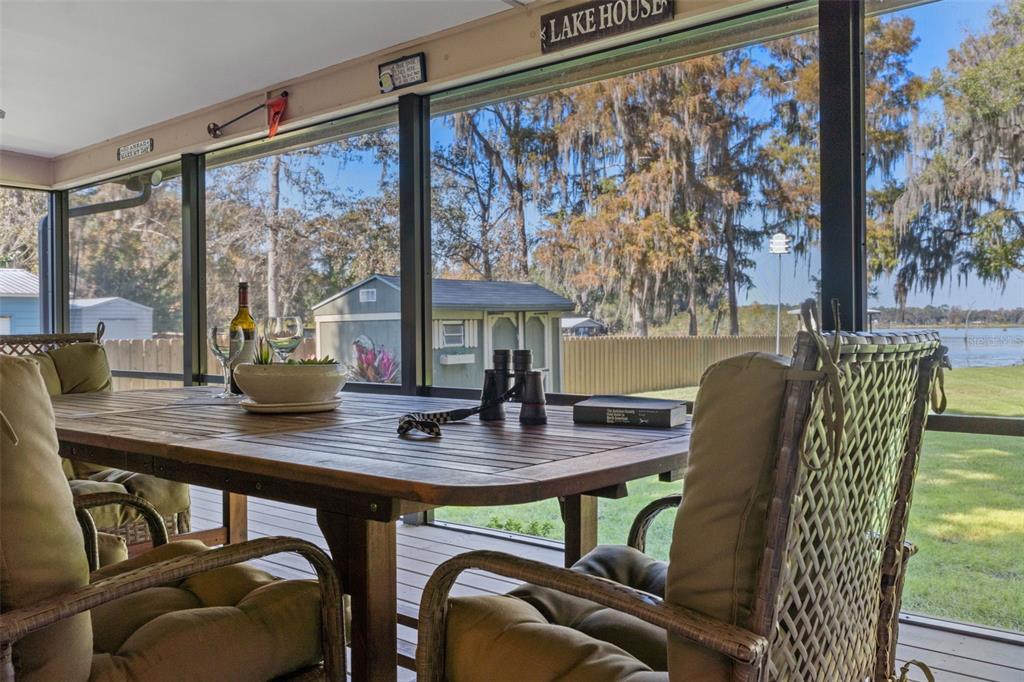 6185 West Riverbend Road Dunnellon, FL 34433 - Photo 10 of 49 a view of a dining room with furniture window and outside view