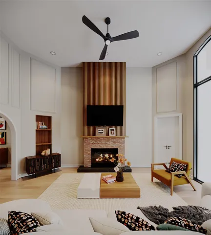 a living room with furniture a rug and a flat screen tv