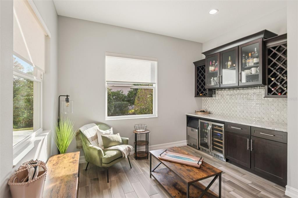1440 Keystone Ridge Circle Tarpon Springs, FL 34688 - Photo 14 of 45 a living room with furniture and a wooden floor
