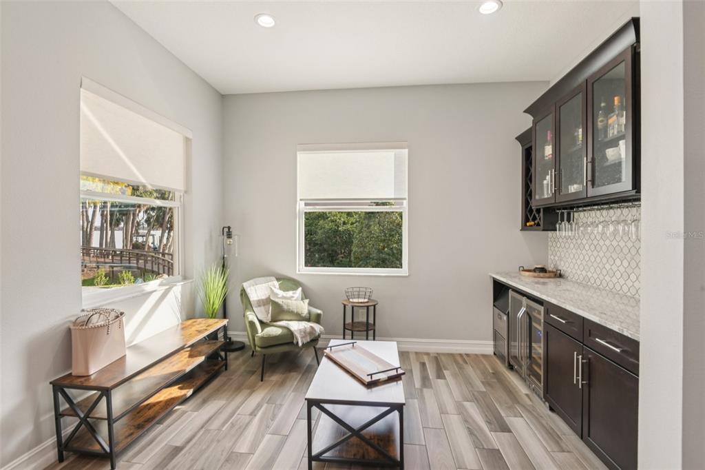 1440 Keystone Ridge Circle Tarpon Springs, FL 34688 - Photo 15 of 45 a living room with furniture and a window