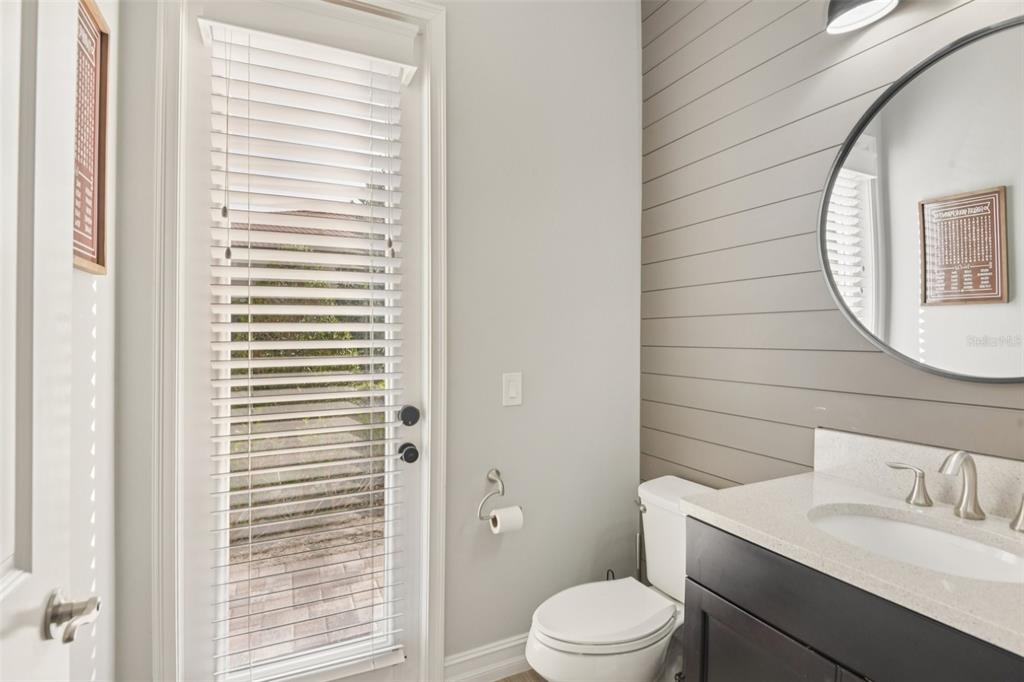 1440 Keystone Ridge Circle Tarpon Springs, FL 34688 - Photo 16 of 45 a bathroom with a toilet a sink and a mirror