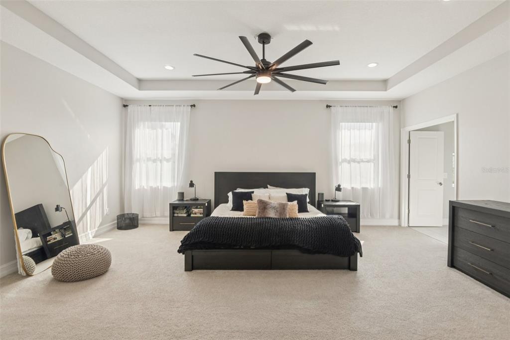 1440 Keystone Ridge Circle Tarpon Springs, FL 34688 - Photo 18 of 45 a living room with furniture a window and a chandelier