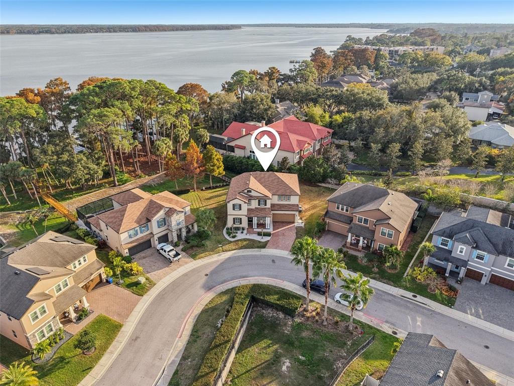 1440 Keystone Ridge Circle Tarpon Springs, FL 34688 - Photo 2 of 45 an aerial view of a house with a ocean view