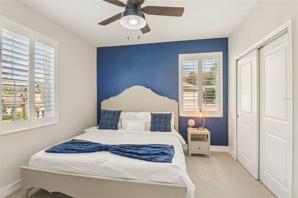 1440 Keystone Ridge Circle Tarpon Springs, FL 34688 - Photo 23 of 45 a bedroom with a large bed and a window