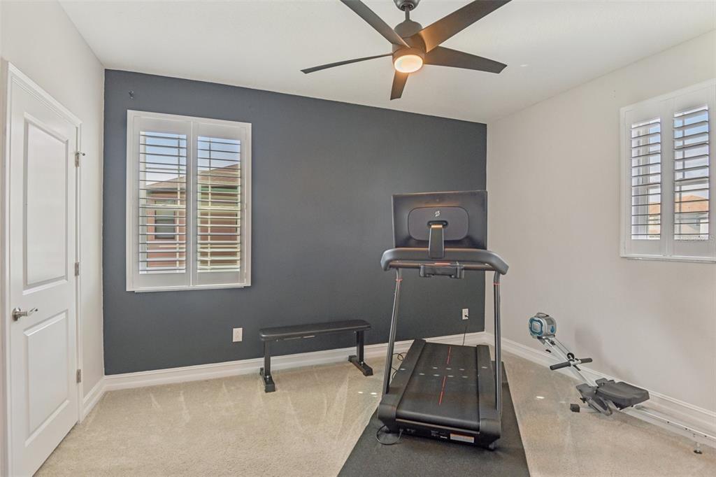 1440 Keystone Ridge Circle Tarpon Springs, FL 34688 - Photo 28 of 45 a room with gym equipment and a window